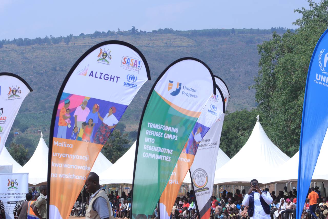 Unidos banners at World Refugee Day event